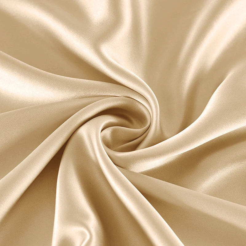 Beige satin fabric with a swirl pattern