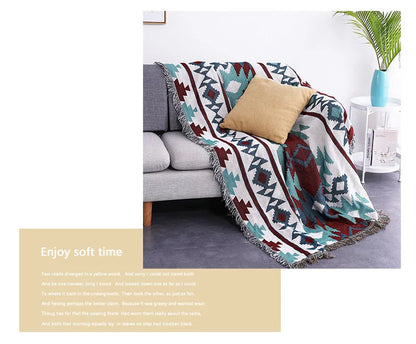 Decorative blanket with geometric pattern on a couch in a living room setting