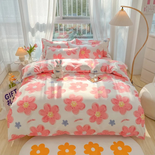 Floral bedding set on a bed in a bright bedroom with curtains and decor.