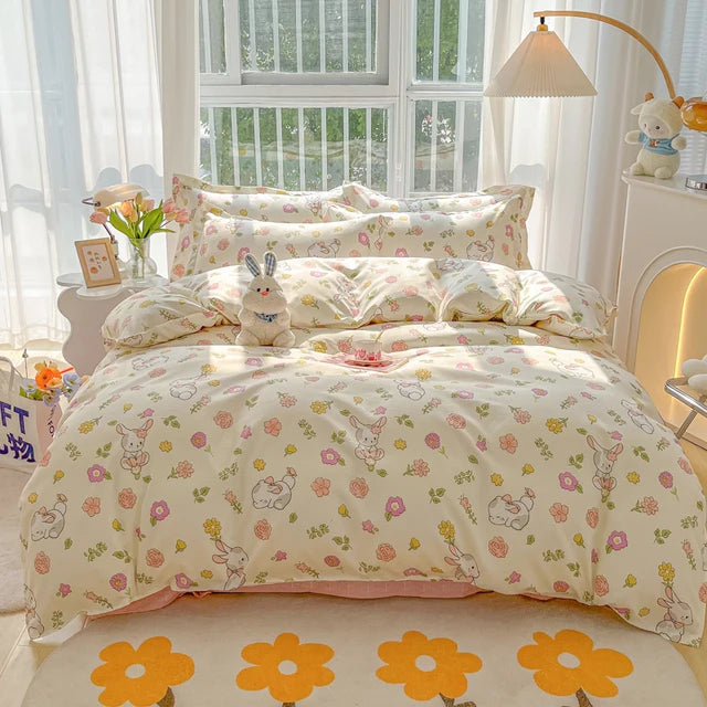 Floral and animal patterned bedding set on a bed in a bright bedroom.