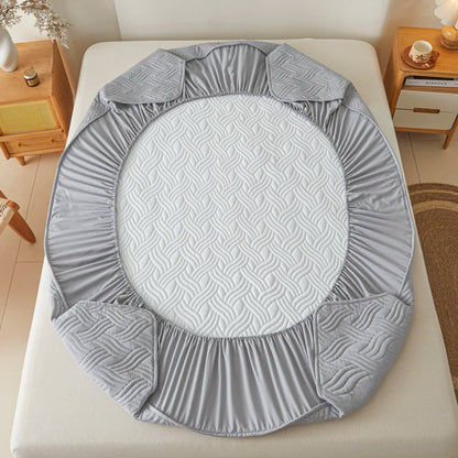 Gray textured circular pad on a bed in a bedroom setting