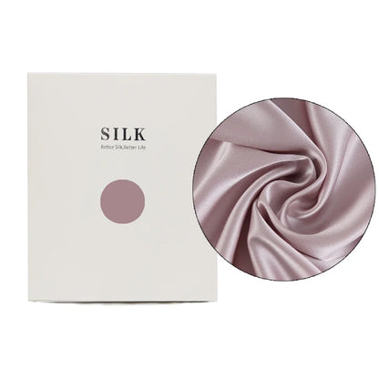 Silk product packaging with a close-up of pink silk fabric on a white background