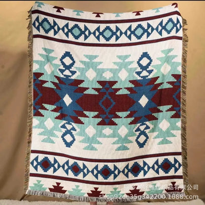 Patterned blanket with geometric design on a beige background