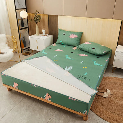 Green bedspread with dinosaur pattern on a bed in a bedroom setting.