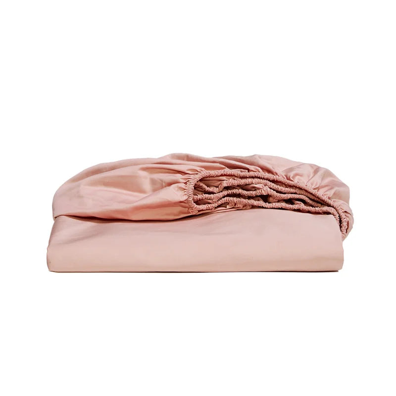 Pink fitted sheet on a white background