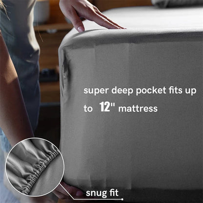 Gray mattress cover with text indicating a super deep pocket fit and snug fit, held by a person.