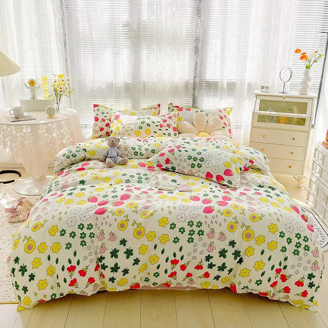 Floral patterned bedding set on a bed in a bright bedroom.