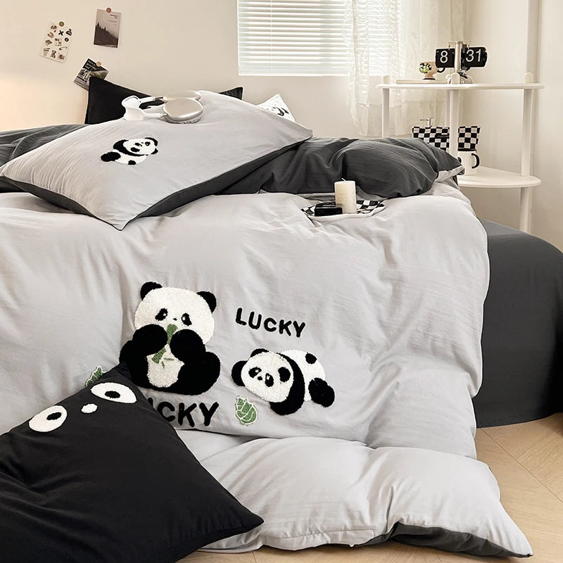 Bedding set with panda design and 'Lucky' text in a bedroom setting.