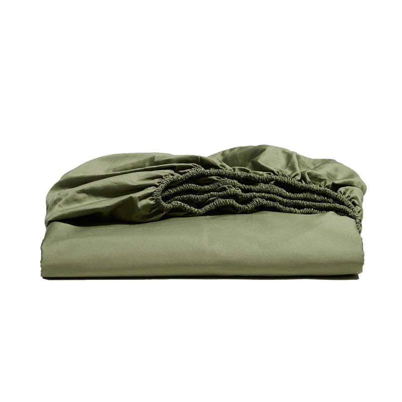 Folded green fitted sheet on a white background