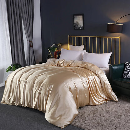Neatly made bed with gold comforter in a bedroom setting.