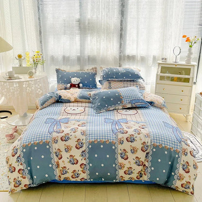 Bed with teddy bear-themed bedding in a bright bedroom