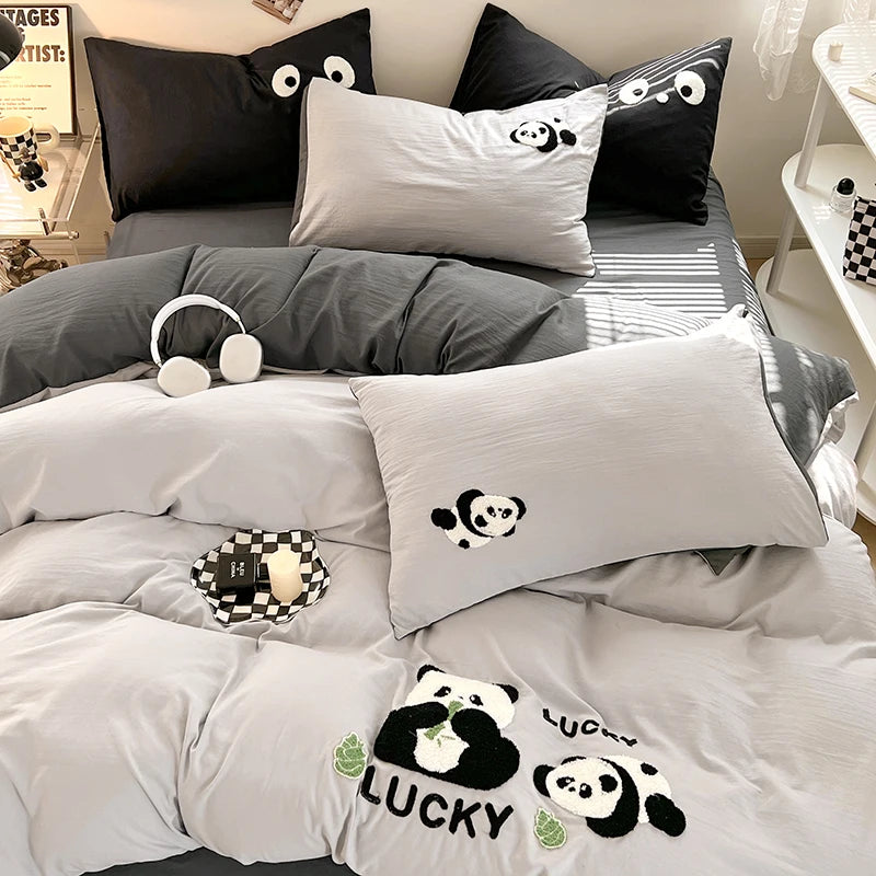 Bedding set with panda design on a bed in a bedroom setting.