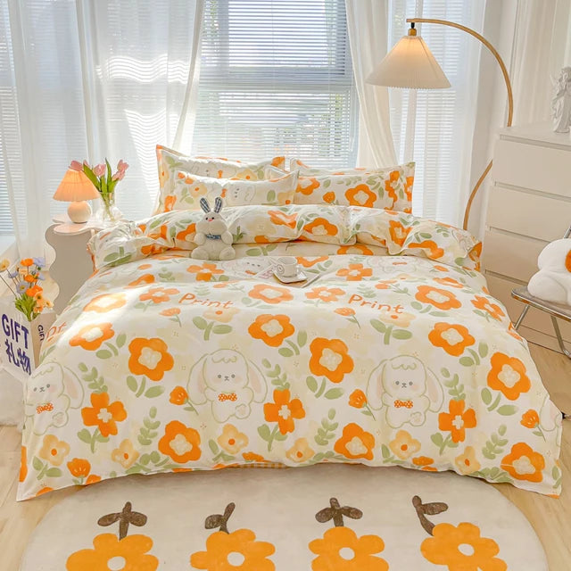 Floral bedding set with cartoon characters on a bed in a bright bedroom.
