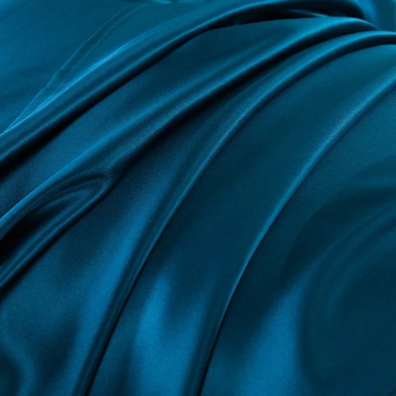 Close-up of blue satin fabric with folds