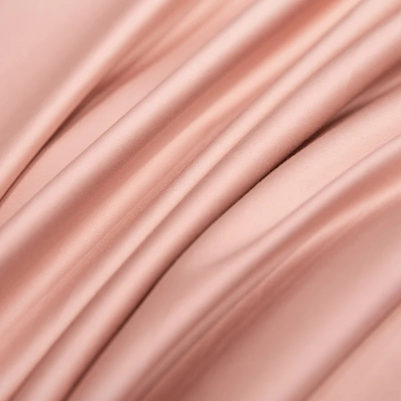 Close-up of rose gold metal surface with reflective quality