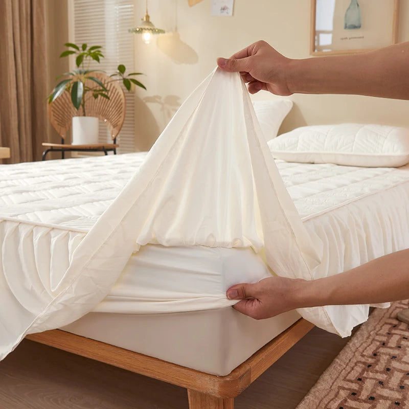 Person holding a white bed canopy over a bed in a bedroom setting.