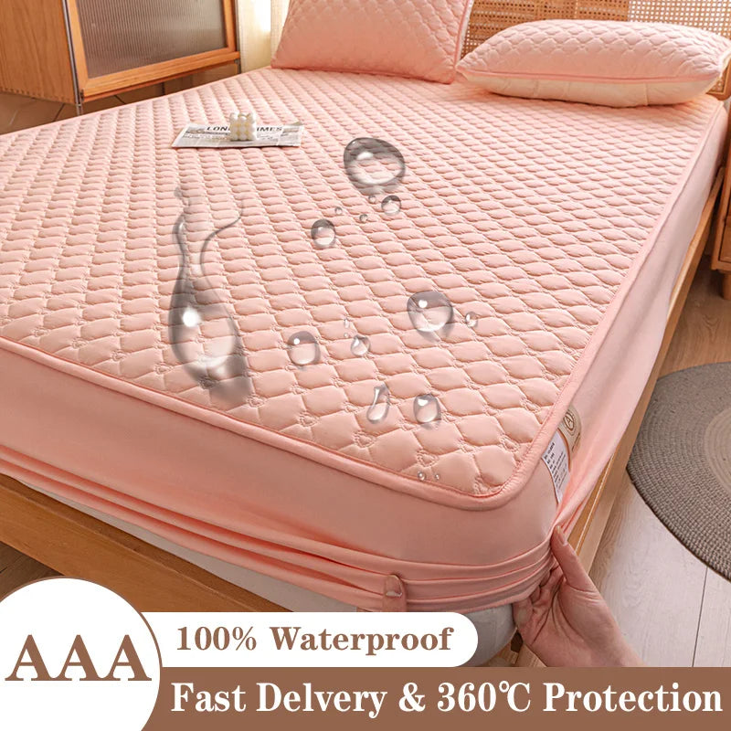 Pink mattress protector on a bed with water droplets demonstrating its waterproof feature, labeled 'AAA 100% Waterproof'.