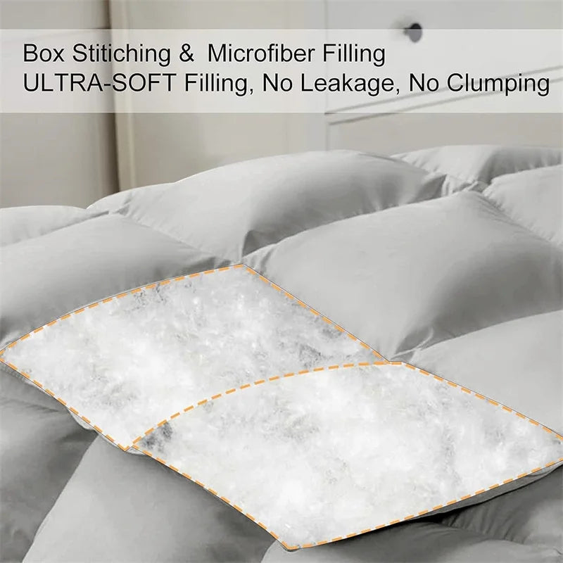 Gray comforter with box stitching and microfiber filling on a bed