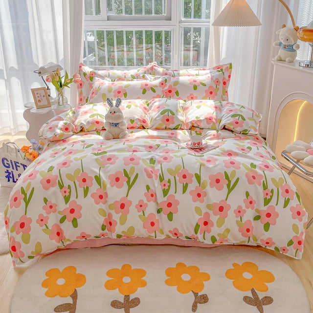 Floral bedding set on a bed in a bright bedroom with a window and lamp.