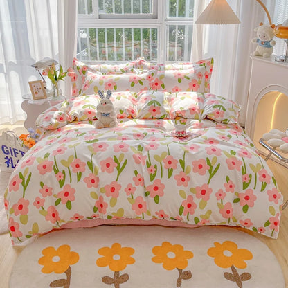 Floral bedding set on a bed in a bright bedroom with a window and lamp.