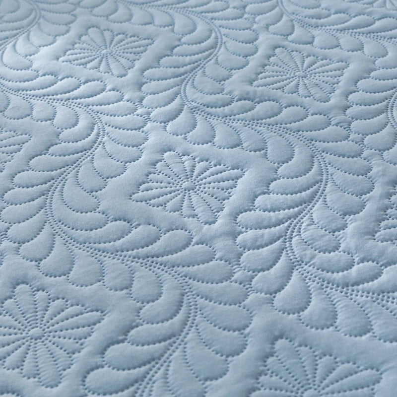 Close-up of textured blue fabric with intricate patterns