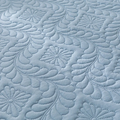Close-up of textured blue fabric with intricate patterns