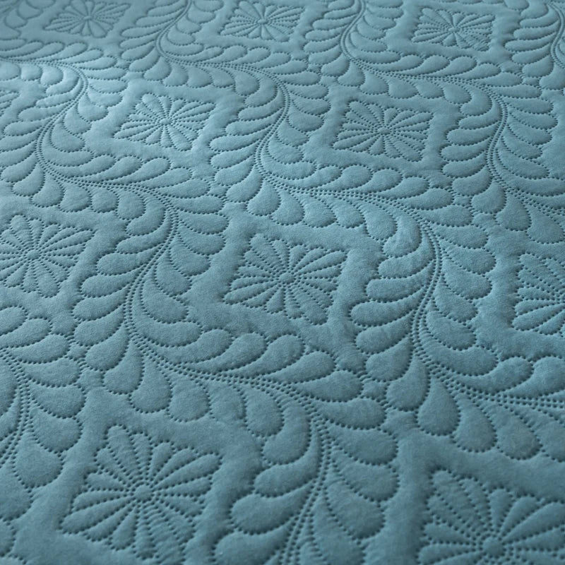 Textured blue fabric with intricate patterns