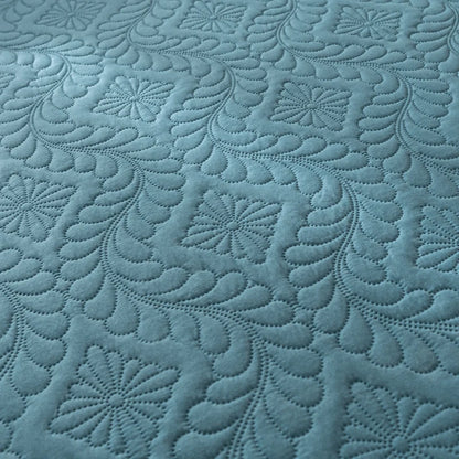 Textured blue fabric with intricate patterns