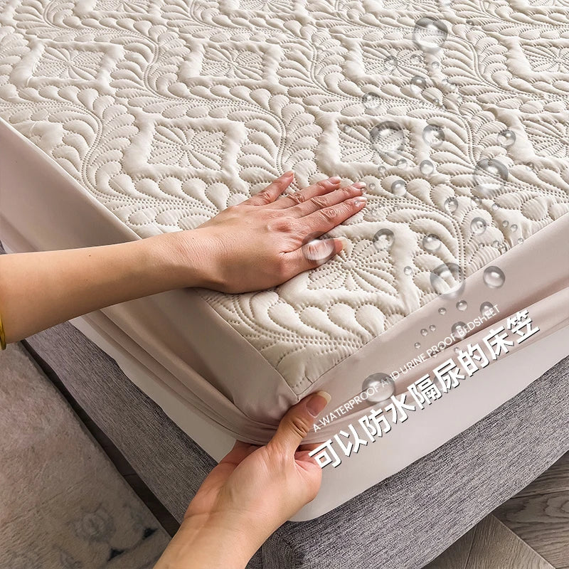 Person touching a textured mattress with water droplets, indicating waterproof feature.