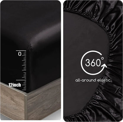 Black fitted sheet with 360-degree all-around elastic feature on a bed.