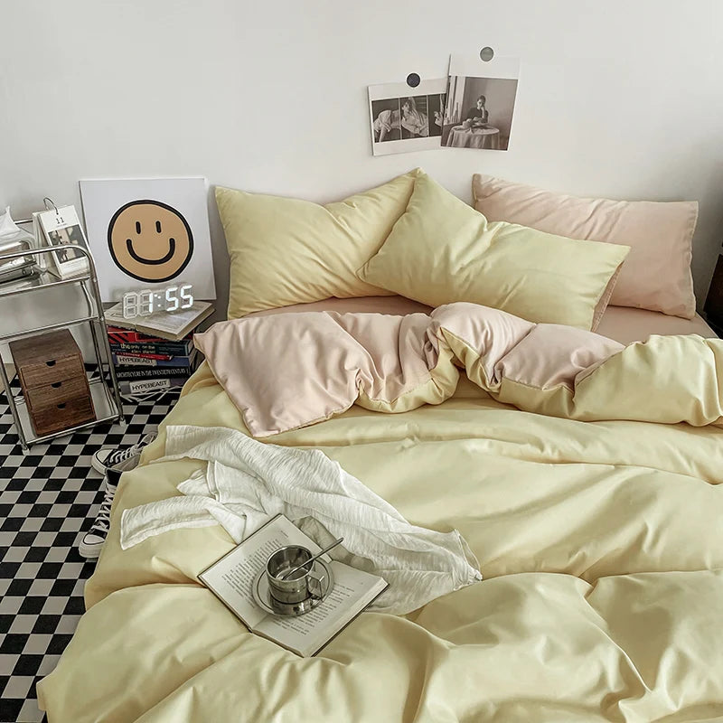Neatly made bed with light-colored bedding in a bedroom setting.