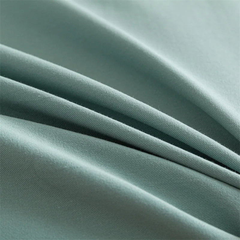 Close-up of teal fabric with folds