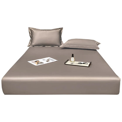 Taupe bed sheet set with pillows on a white background