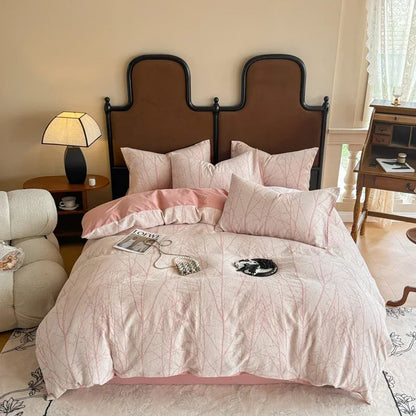 Bedroom with pink bedding and a wooden headboard