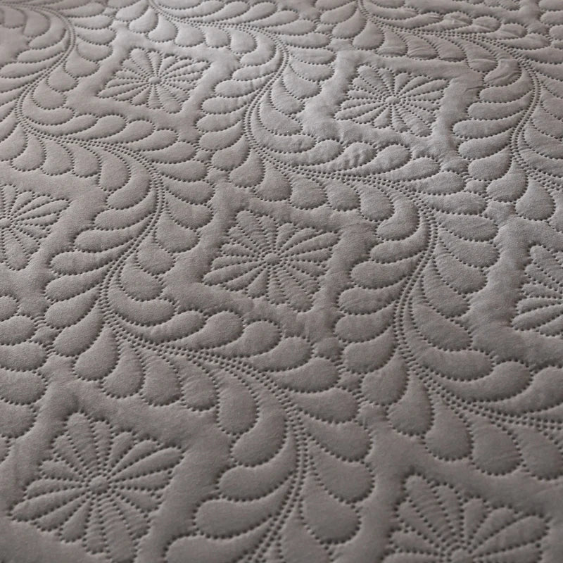 Close-up of textured gray fabric with floral patterns