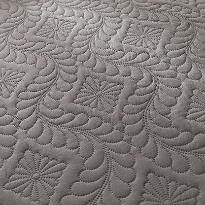 Close-up of textured gray fabric with floral patterns