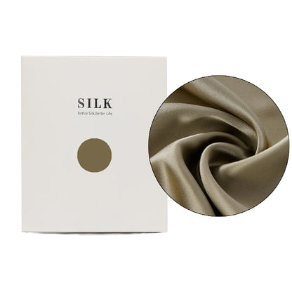 Silk fabric with a close-up detail and a branded box on a white background