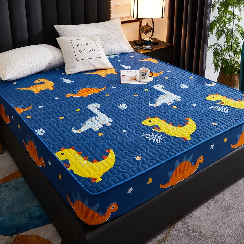 Blue mattress cover with dinosaur pattern in a bedroom setting