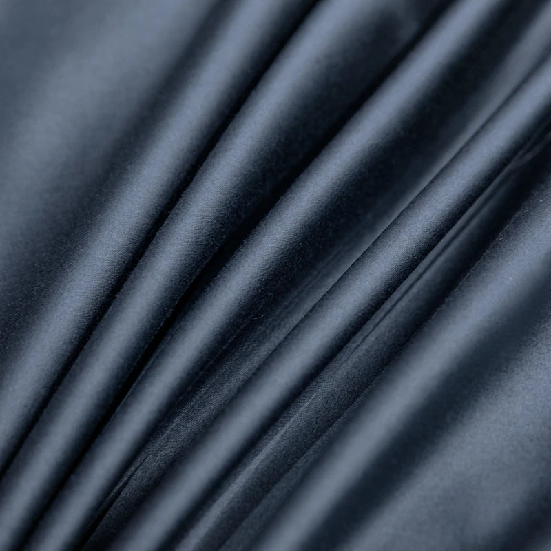 Close-up of dark blue fabric with folds