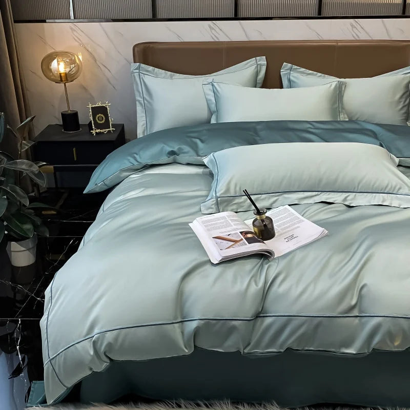 Bed with light blue bedding in a modern bedroom setting.
