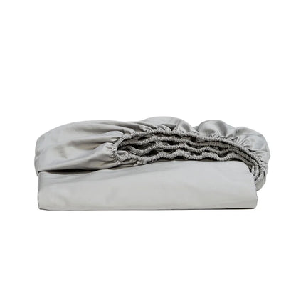 Folded light gray fitted sheet on a white background