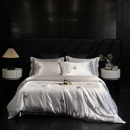 White bedding set with embroidery on a black bed in a darkly decorated room.