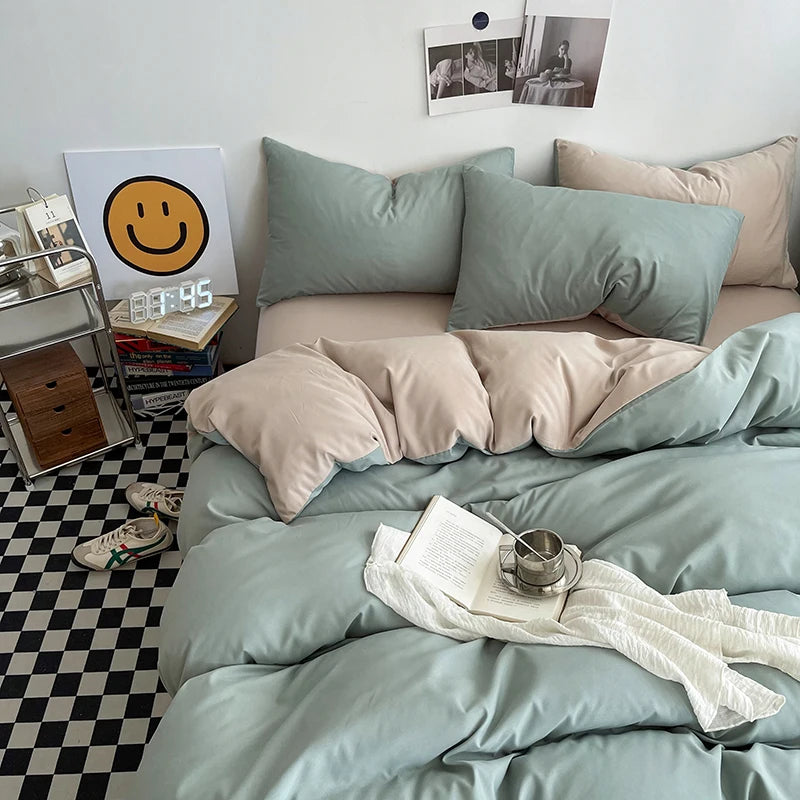 Bedroom with light blue bedding and pillows, checkered floor, and decor elements.