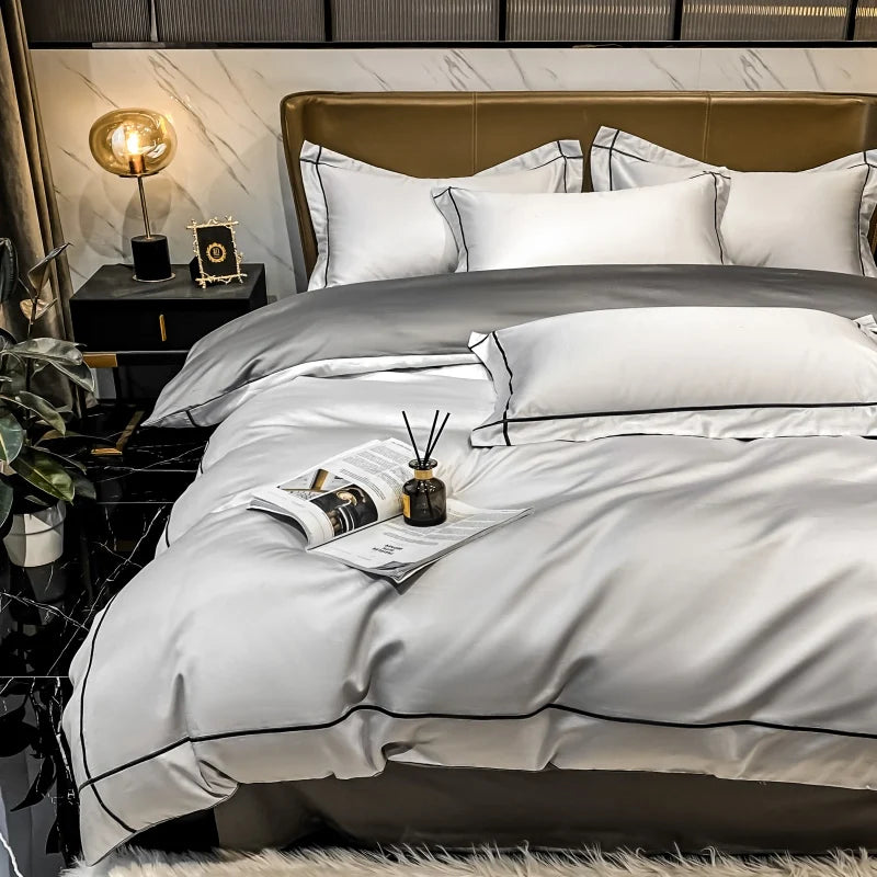 Neatly made bed with white bedding and brown headboard in a bedroom setting.