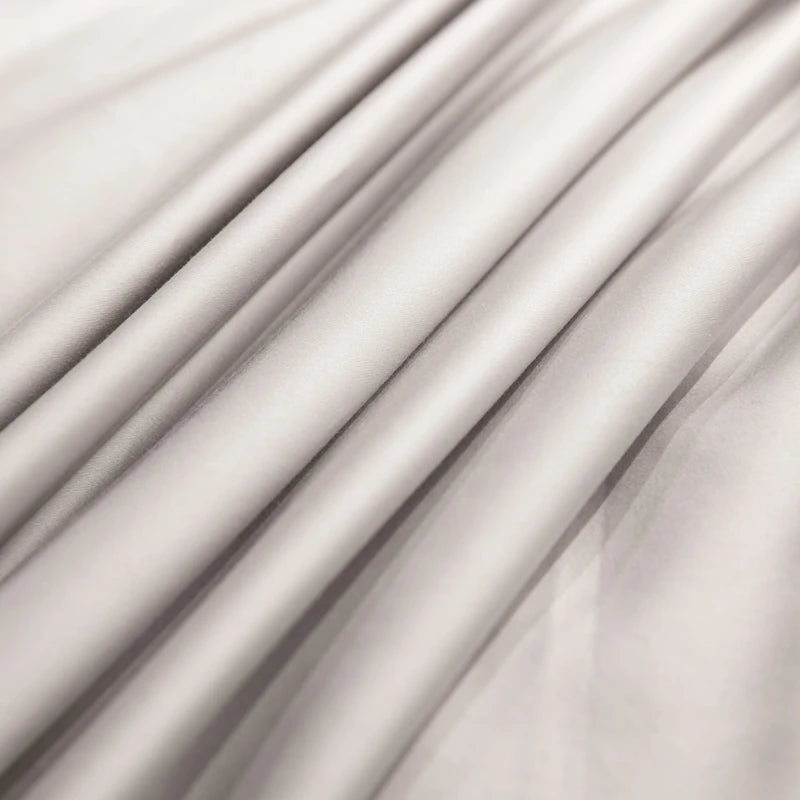 Close-up of Silver draped fabric with soft shadows