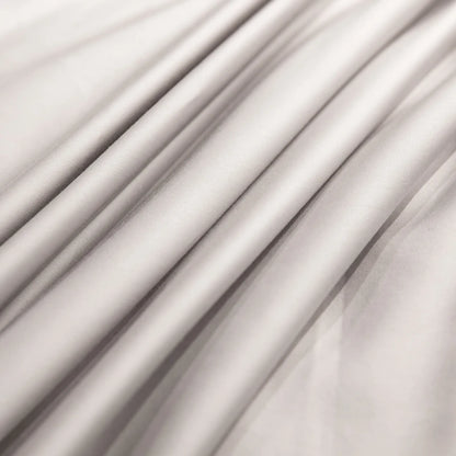 Close-up of Silver draped fabric with soft shadows