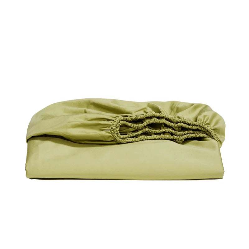 Folded green fitted sheet on a white background