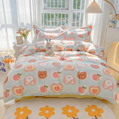 Children's bedroom with cartoon-themed bedding featuring bears and apples.