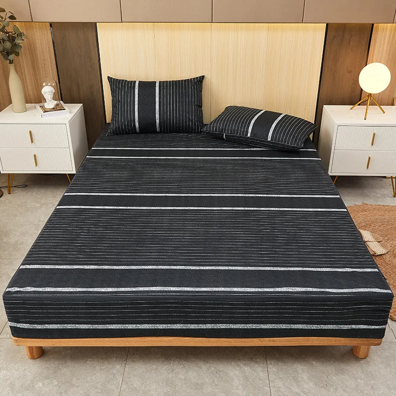 Bed with black and white striped bedding in a bedroom setting