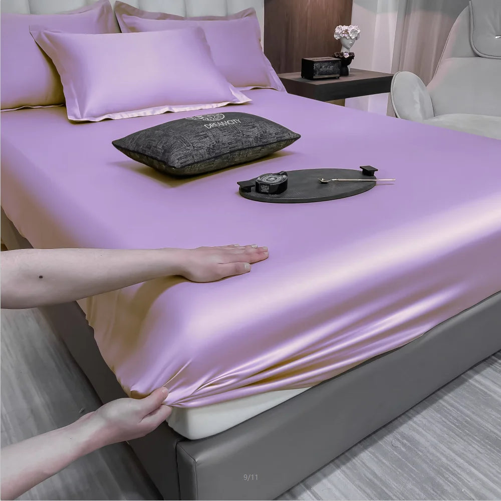 Purple satin sheet being pulled over a bed with a record player on top.